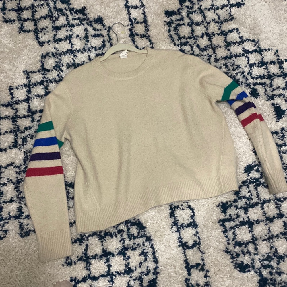 Sweater with rainbow arm stripes